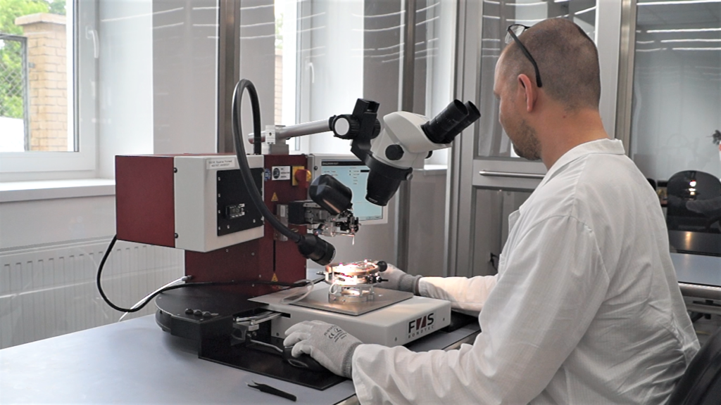 SpaceForest's engineer using wire bonder.