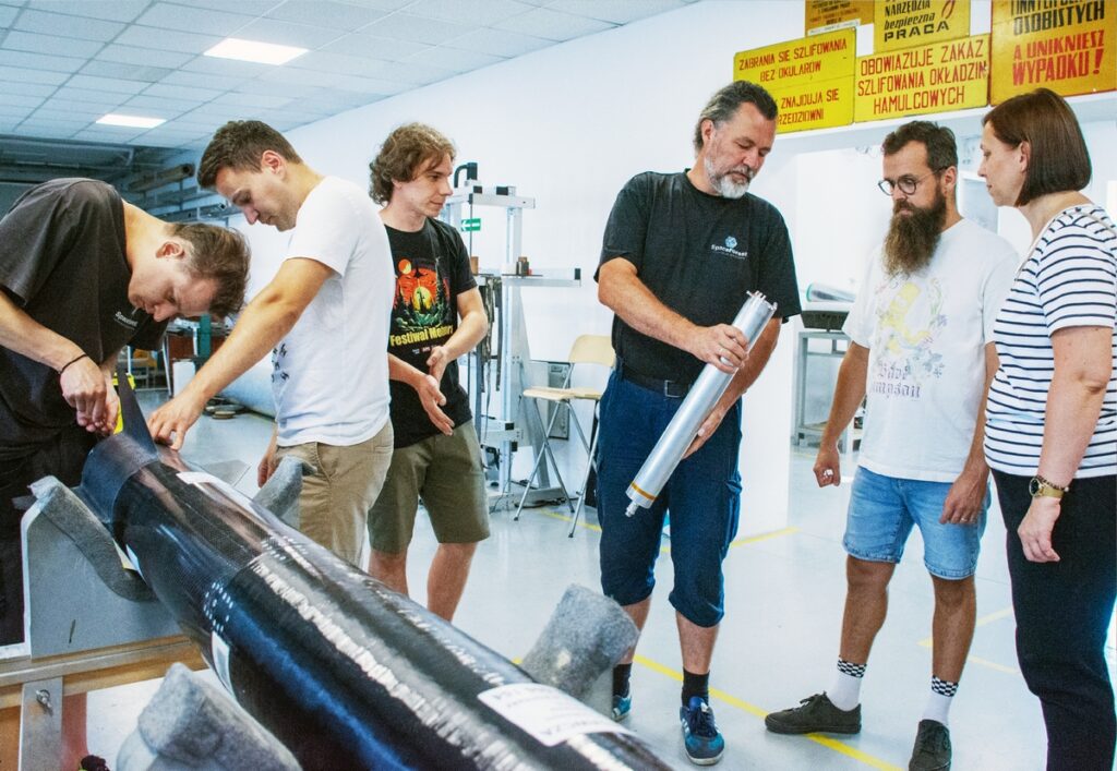 Engineers completing the assembly of a test rocket body.