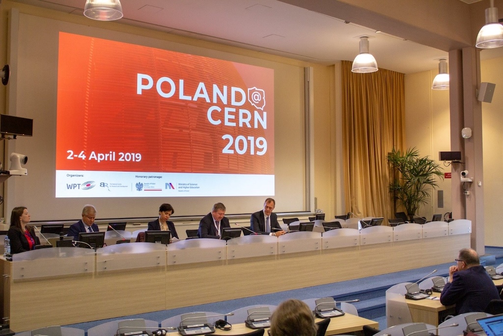 Conference session during Poland@CERN event with attendees listening to presentation.
